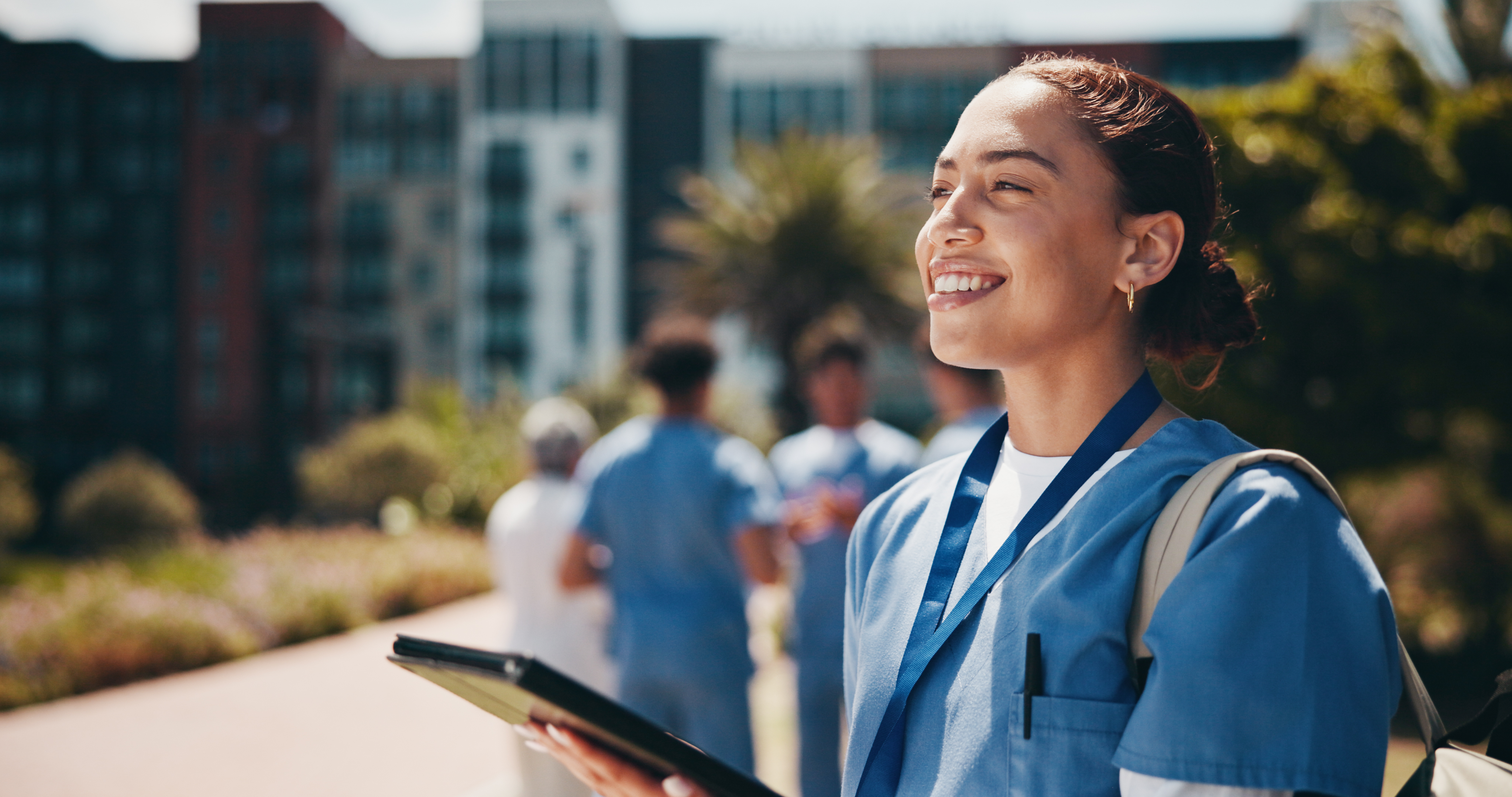 Smiling nurse outside
